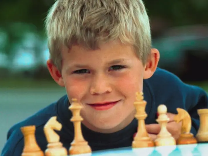 Chess world champion Magnus Carlsen, of Norway, studies the board